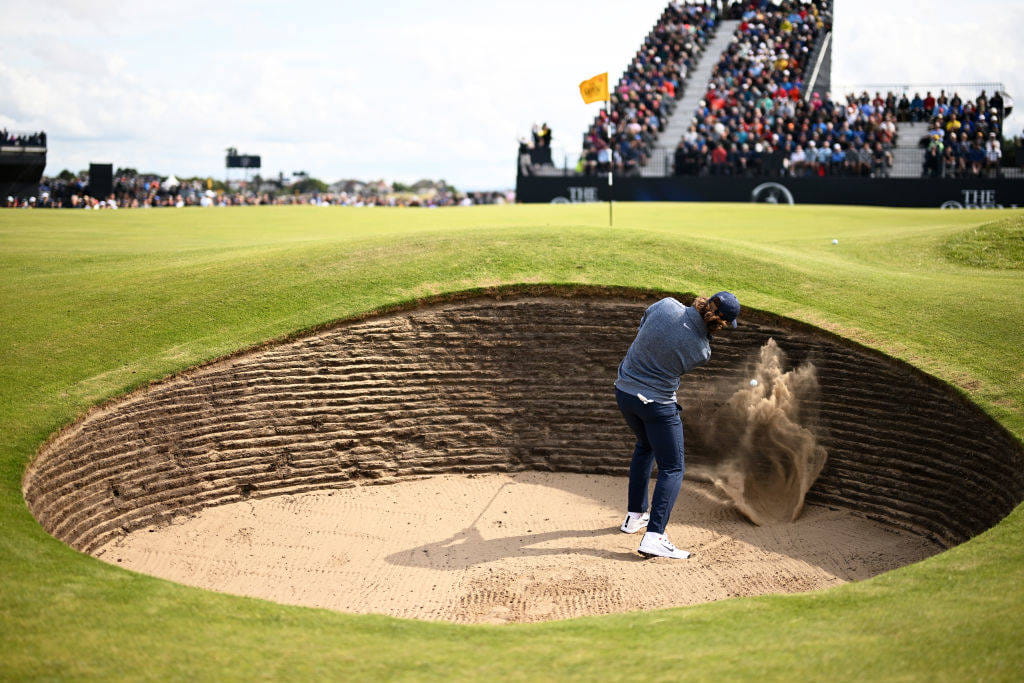 Tommy Fleetwood escapes from a bunker at the sixth